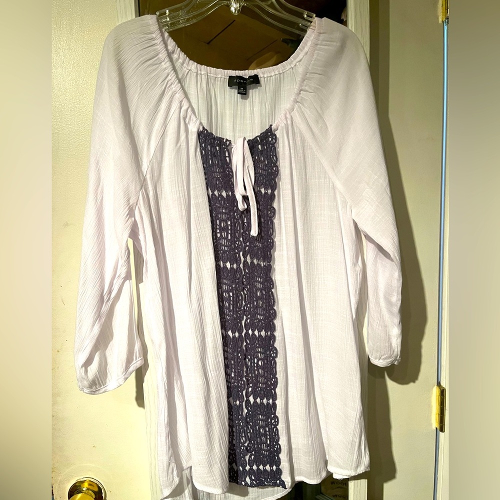 Lovely blouse with stitching design in front.